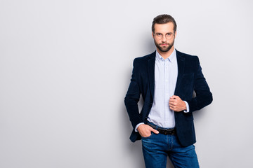 Portrait of well-dressed handsome attractive graceful brutal luxurious dreamy elegant bearded guy wearing velvet jacket checkered shirt denim jeans isolated on gray background copy-space