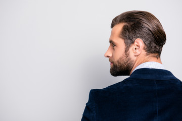 Profile half-faced side view portrait of handsome luxurious attractive stylish modern authoritative dreamy professional elegant entrepreneur, dark blue blazer isolated on gray background copy-space - obrazy, fototapety, plakaty