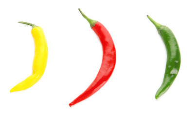 Different chili peppers on white background