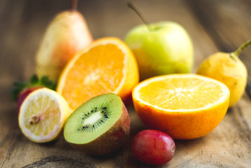 tropical fruit salad on wooden background