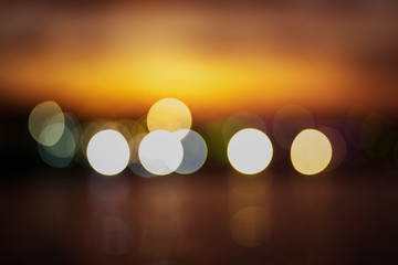 Abstract blurred lights on yellow-orange background