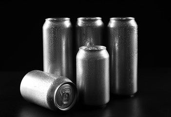 Cans of cold beer on dark background