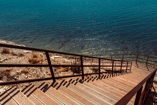 Wooden Stairs to the sea. Vacation Travel Walking Concept