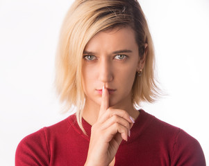 Fingers on lips- girl making silence gesture shh sign Isolated on white