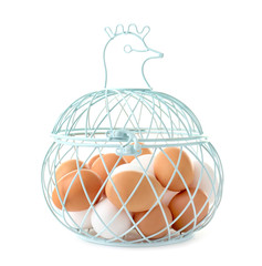 Fototapeta na wymiar Metal basket with chicken eggs on white background