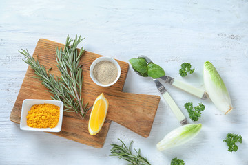 Various spices with herbs on wooden background