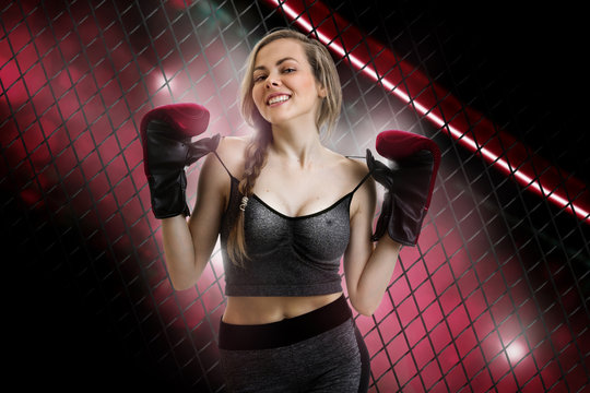 Cheerful young girl mma fighter smiles