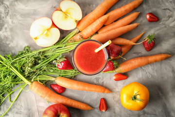 Glass of fresh tasty smoothie and ingredients on table, top view