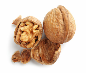 Tasty walnuts on white background