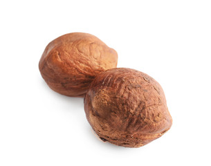 Tasty hazelnuts on white background
