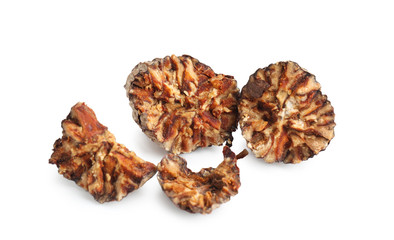 Crushed nutmegs on white background