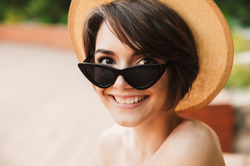 Close up of a lovely young girl in summer hat