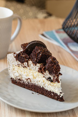 Cream cheese cake with chocolate cookies and brownies