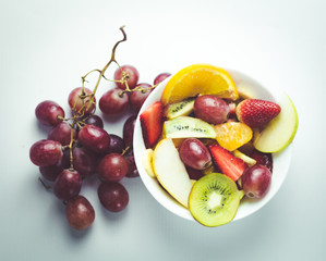 tropical fruit salad on white background