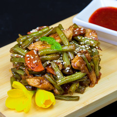 Braised turkey breast with asparagus, baby corn, onion, garlic, green beans, parsley and rosemary