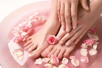 Acrylic prints Pedicure Young woman undergoing spa pedicure treatment in beauty salon, closeup