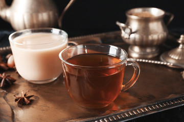 Obraz na płótnie Canvas Glass cups of tea on tray