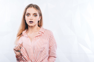 Obraz premium Expressive facial expressions.Girl fashion model with purple makeup
