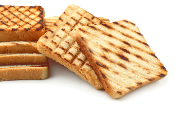 Tasty toasted bread on white background