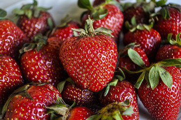 Fresh strawberries arranged in a plate. Selective focus.