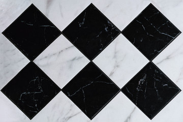 Fragment of black and white tile floor