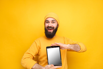 Bright male model with tablet for sale