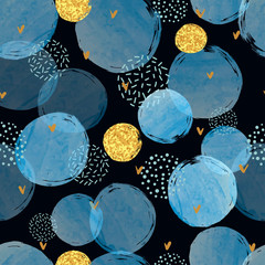 Seamless abstract dotted pattern with blue and golden circles on dark background. 