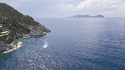 Aerial view of Ponza, island of the Italian Pontine Islands archipelago in the Tyrrhenian Sea, Italy. On the island there are few houses and in the background there is Palmarola.