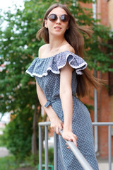 happy young women in dress on street 