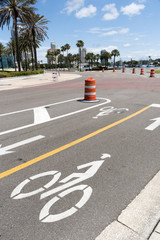 St Petersburg, Florida, USA. 2018. Painted signs for a cycleway on the waterfront in St Petersburg,...