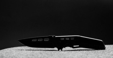 knife military on a dark background