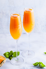 Italian Bellini alcoholic cocktail made from sweet ripe melon with basil flavor. Ideal drink for snacks