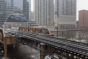 Snow lightly covering a train bridge