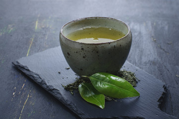hot green tea in a traditional bowl
