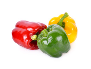whole fresh green, red and yellow bell pepper with stem on white background