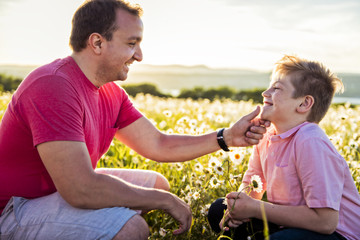 Father spending time with son during the sunset.