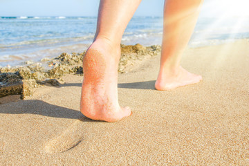 Beautiful traces with feet on sea nature background