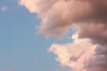 Pink clouds in sunny sky