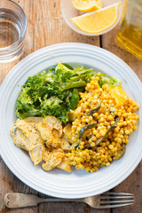 Fiery Moroccan chicken with giant spicy couscous, roasted vegetables and tzatzaki dressing 