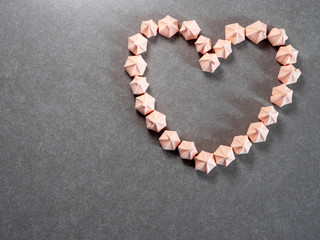 Colorful meringue cookies, arranged in the shape of a heart, top view