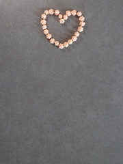 Colorful meringue cookies, arranged in the shape of a heart, top view