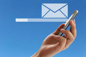 Hand of a businessman holding a smartphone and have white envelope of e-mail symbol.