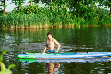 Fototapeta premium A man practicing with SAP Board,