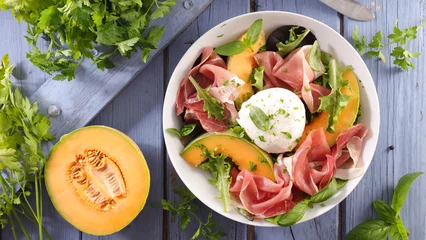 Fotobehang melon salad with mozzarella and ham © M.studio