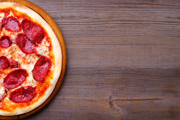 Restaurant, food delivery, pizzeria menu concept. Appetizing pepperoni pizza flat lay with copy space. Delicious classical recipe, traditional Italian snack