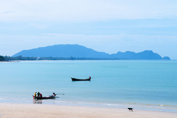 Fototapeta premium Peaceful beach and long tail fishing boat of southern Thailand in Khanom, Nakhon Si Thammarat