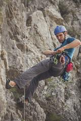 Obraz premium A Man Climbing a Mountain