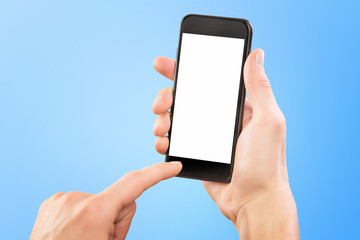 Mockup of male hand holding black cellphone isolated at blue background.