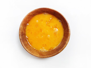 Fresh eggs in wooden bowl on white background