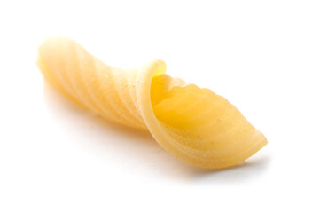 closeup of penne pasta on white background